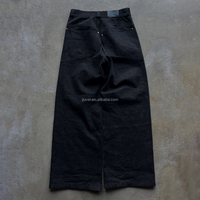 Pantalon en denim brut noir 100% coton 14oz coupe baggy avec boutons, fabriqué sur mesure