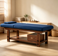 Table de massage professionnelle en bois bleu foncé sur mesure avec coussin de tête et tiroir pour usage en salon de beauté, SPA, hôtel, salle de sport ou salon.
