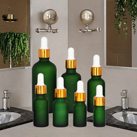 Flacon d'huile essentielle en verre mat vert vide de luxe Fuyun, flacon cosmétique européen givré, flacon compte-gouttes rond en verre doré métallique