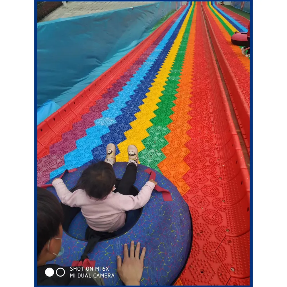 Parque de Atracciones Parque Donut planeador de arco iris seco nieve Donut diapositiva para juego al aire libre juegos al aire libre para adultos y niños