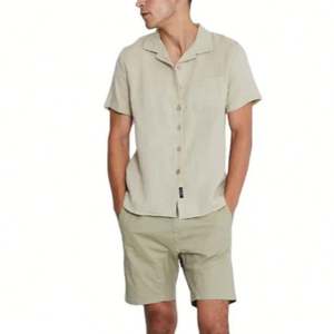 เสื้อยืดผ้าฝ้าย100สำหรับผู้ชายเสื้อทรงสลิมฟิตติดกระดุมแบบลำลองติดโลโก้ - Product Image 4