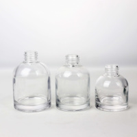 Vente en gros de bouteilles rondes en verre transparent de qualité supérieure bouteille de 50ml 100ml 150ml