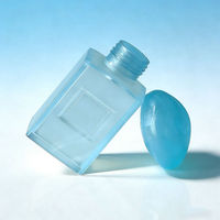 Crème exfoliante cosmétique en flacon carré bleu givré de 100 g, essence de lait, après-shampoing, shampoing en flacons séparés