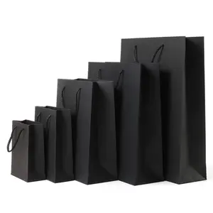 Bolsa de regalo de papel negro con logotipo personalizado, bolsa de compras de papel de promoción, venta al por mayor