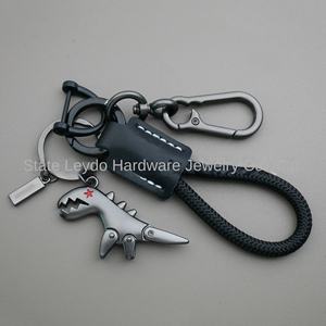 LLavero de aleación de <span class=keywords><strong>dinosaurio</strong></span> pequeño de dibujos animados transfronterizo chica coche cuero cosido a mano cuerda trenzada mochila colgante regalo - Product Image 2