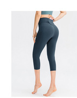 OEM Pantalon court de yoga double face nu avec poches élastique ajusté Hip Lift Fitness Running Sports Capri Pantalon avec poches