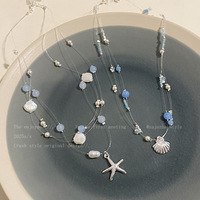 Collier ras du cou superposé pour femme, style station balnéaire, avec étoile de mer, coquillage et perle électroplaquée, unique, nouvelle collection 2026, ambiance estivale