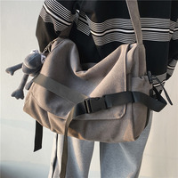 Sac bandoulière en toile grande capacité unisexe, motif géométrique, style décontracté pour étudiant, idéal pour livres