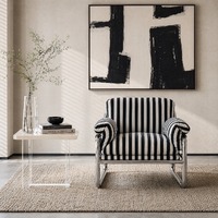 Fauteuil individuel en velours, durable, avec structure métallique et rembourrage en mousse, idéal pour hôtels et salons, design minimaliste.