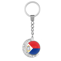 Porte-clés personnalisé en forme de croissant de lune rotatif, motif creux en alliage, double face, affichant le drapeau de Sainte-Kitts-et-Névis