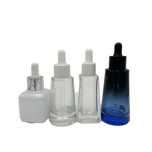 Botella cosmética de aceite esencial redonda con cuentagotas de vidrio pequeño transparente personalizado