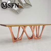 MSFN Direktvertrieb Luxuriöser Moderner Kunst-Esstisch Skulpturale Gesinterte Steinplatte Verschlungene Edelstahlbeine Apartment