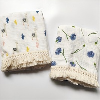 Couverture d'emmaillotage en mousseline de coton biologique 100% tissée avec motif de feuilles marines et étiquette personnalisée