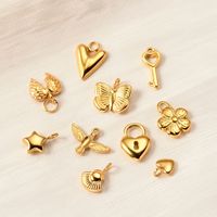 Charmes en acier inoxydable plaqué or 18 carats, forme cœur, papillon, cadenas, clé, pour la création de bijoux DIY