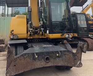 Excavatrice sur pneus CAT M317D2 <span class=keywords><strong>d</strong></span>'occasion à faible nombre <span class=keywords><strong>d</strong></span>'heures de fonctionnement avec dozer frontal, stabilisateurs arrière et ligne de brise-roche préinstallée pour l'asphalte - Product Image 2