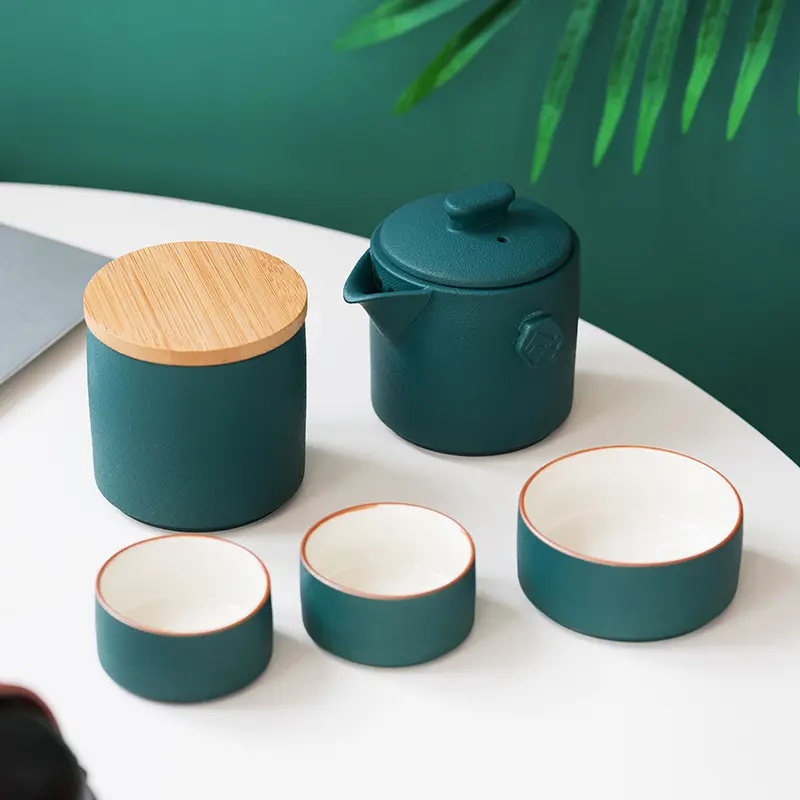 Penjualan Terbaik portabel hadiah bisnis perjalanan Cina keramik Set teh Pot dari tiga cangkir Logo kustomisasi