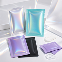 Pochettes plates personnalisées en nylon holographique laminé à trois soudures latérales pour l'emballage d'échantillons cosmétiques