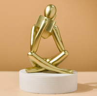 Sculpture abstraite moderne en résine Art Déco, représentant une figure humaine assise tenant un livre, pour la décoration de la maison