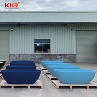 Baignoire autoportante moderne en pierre artificielle bleu mat avec drain pour usage hôtelier