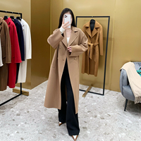 Manteau long en cachemire et laine double face pour femme, style mode automne-hiver 2026, coupe ample et oversize, double boutonnage, couleur camel