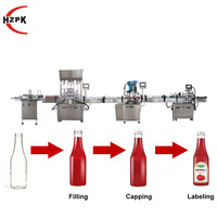 Ligne de production HZPK pour le remplissage, le bouchage et l'étiquetage de pâtes liquides de qualité alimentaire pour les sauces, le miel, les boissons, les aliments, les bouteilles en verre et en plastique