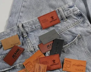 Etichetta di abbigliamento per jeans di marca personalizzata di vendita calda etichetta in pelle pu goffrata per Jeans