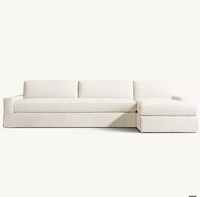 Ensemble de canapés modulaires MAXWELL au design italien classique, en forme de L, avec jupe en tissu éponge, personnalisable et écologique, pour hôtels et appartements