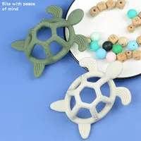 Yeni tasarım duyusal bebek diş çıkarma gıda sınıfı oyuncaklar yumuşak deniz kaplumbağası silikon bebek Bpa ücretsiz bebek diş kaşıyıcı
