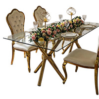 Table à manger rectangulaire en verre transparent de luxe léger, fabrication directe d'usine de Foshan, pieds en acier inoxydable plaqué or pour la maison