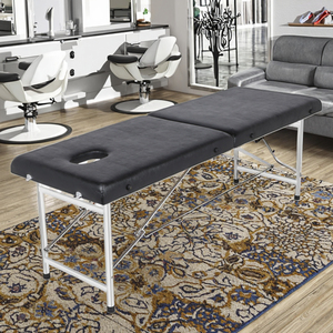 Mesa de Masaje Portátil Resistente, Cuero PU Suave, Carga Estática de 600 kg, Plegable para Uso en Belleza, Tatuajes y Terapia - Product Image 1