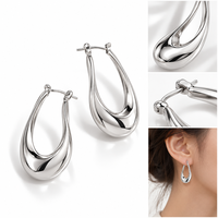 Anting Hoop Oval Geometris Mosen ODM dengan Gaya Logam Cair Modern dan Sentuhan Akhir Warna Perak.
