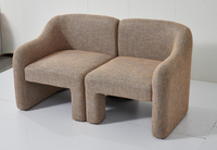 Fauteuil en tissu texturé marron contemporain Chaise de loisirs minimaliste et élégante avec revêtement moderne Caractéristiques
