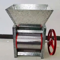 Machine à décortiquer et à peler les grains de café frais, à commande manuelle et moteur, pour le traitement du café