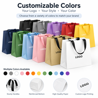 Sac shopping en papier carton ivoire de luxe personnalisé 200 g/m² avec longue poignée en ruban pour l'emballage de vêtements, de chaussures et de bijoux de boutique