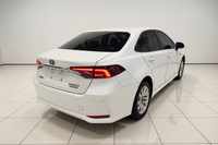 Toyota Corolla Hybride 1.8L Édition Elite Automatique Berline d'occasion 2023 Volant à Gauche Pneus R16 Feux LED Toit Ouvrant Fonctions Intelligentes Euro VI 5
