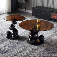 Table basse sphérique en verre noir moderne, minimaliste et durable, avec structure en métal, pour salon