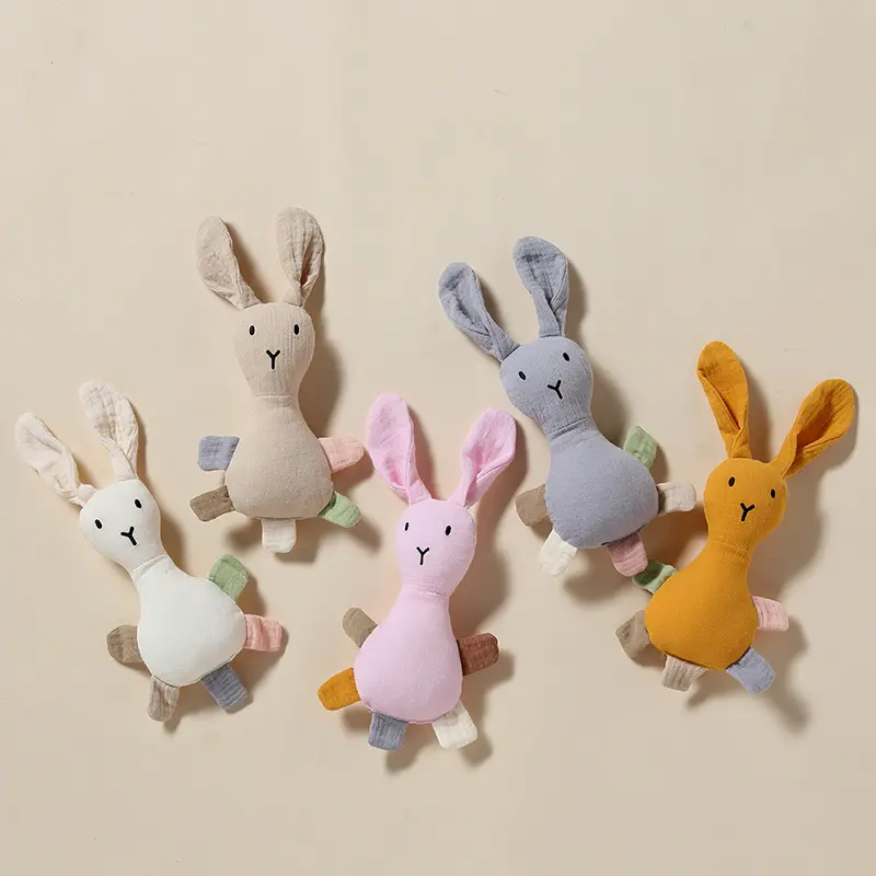 Les lapins de couleur unie peuvent être grignotés sur la poupée apaisante de sonnerie bébé en peluche jouet de poupée doux bébé confort jouets