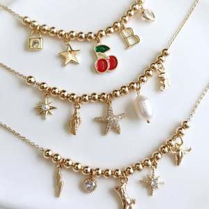 Venta al por mayor nuevo diseño collar 18K chapado en oro Multi encanto collar cereza FE corazón bola cadena Collar para mujer - Product Image 1