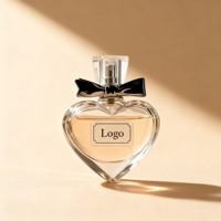 Flacon de parfum sphérique en verre transparent de luxe en forme de cœur 100 ml 50 ml 60 ml 100 ml avec bouchon et vaporisateur personnalisé Boîte d'emballage