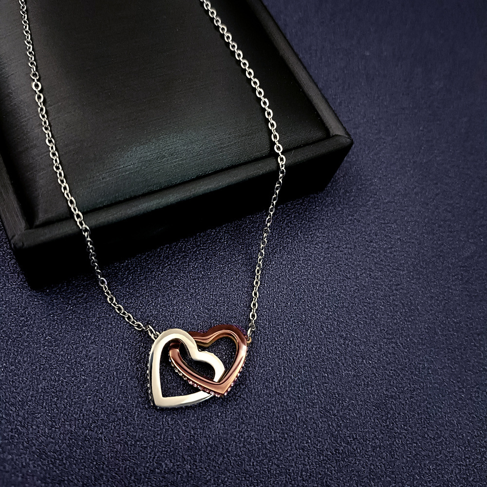 doble corazón de oro rosa