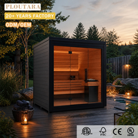 Sauna extérieur moderne PLOUTARA en forme de cube, revêtement en bois foncé, toit plat, double porte vitrée, chauffage au roche pour salle de sport, villa, complexe hôtelier, spa