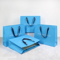 Sac en papier de luxe ivoire en carton robuste avec logo personnalisé pour vêtements