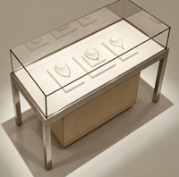 Vitrine à bijoux LED haut de gamme en acier finition laquée, meuble de présentation en métal durable pour magasin de luxe, fabrication directe usine