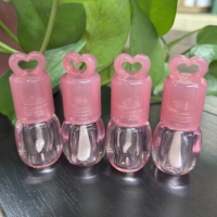 Emballage vide de tube de brillant à lèvres rose clair personnalisé de 3ml en ABS avec grande baguette magique de marque privée pour la sérigraphie cosmétique