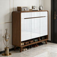 Meuble à chaussures moderne en bois massif blanc laqué, structure en noyer, design modulaire rotatif et réglable pour l'entrée et le couloir