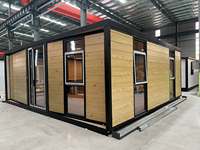 Maison conteneur biplan à toit plat extensible de 20 pieds avec panneaux muraux en verre certifiés CE