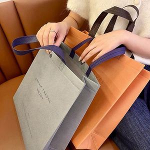 Bolsas de tela no tejida personalizadas al por mayor, bolsas ecológicas de película engrosada, bolsas de compras publicitarias personalizadas - Product Image 4