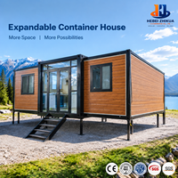 Maison modulaire conteneurisée surélevée et extensible sur mesure avec pieds de support réglables pour terrains inégaux