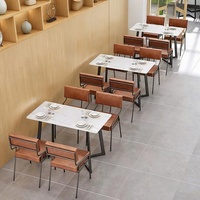 Bornes de restauration rapide modernes en PU avec sièges confortables et ensemble table-chaises en quartzite pour usage commercial dans les restaurants et cafés