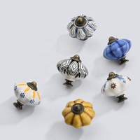 Boutons de meuble classiques élégants et traditionnels en céramique et alliage de zinc de type rond pour tiroirs de commode de chambre d'hôtel